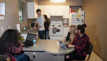 A group of students inside a dorm at Stan State.