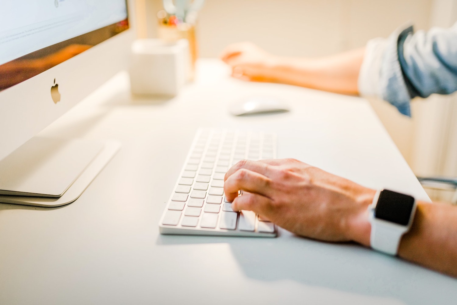 hands at a computer keyboard