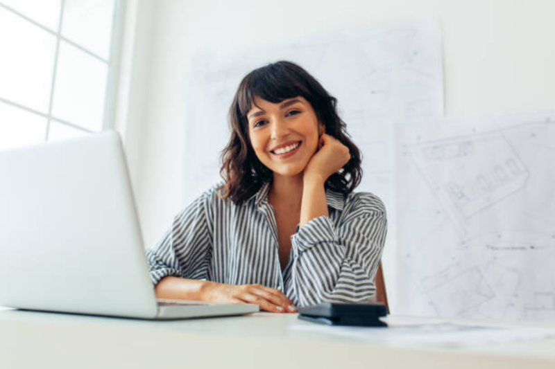 individual smiling at desk