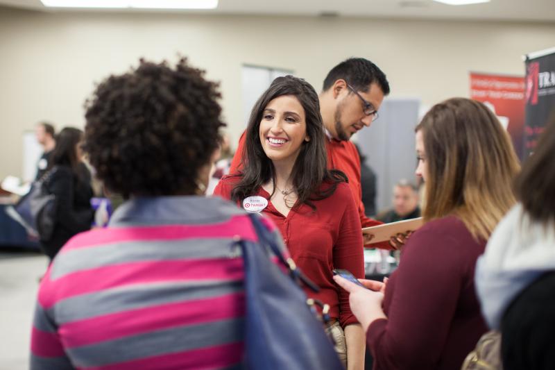 Target representative speaking with potential employees.