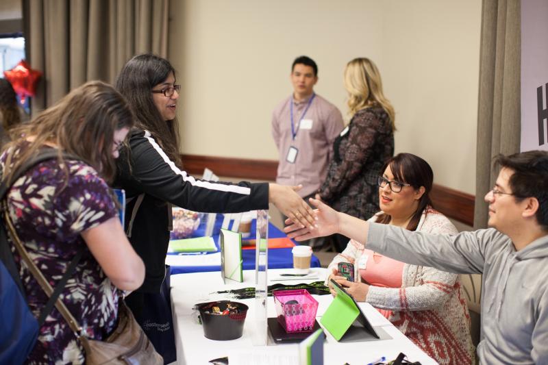 shaking_hands.jpeg Students introducing themselves to potential employers