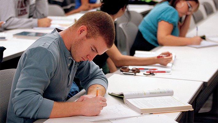 Students taking notes.