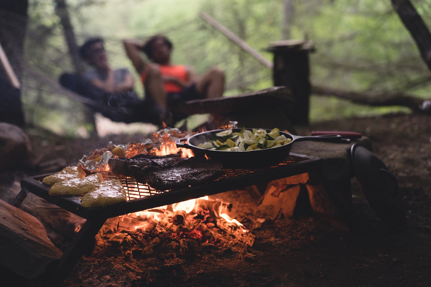 A campfire site cooking.