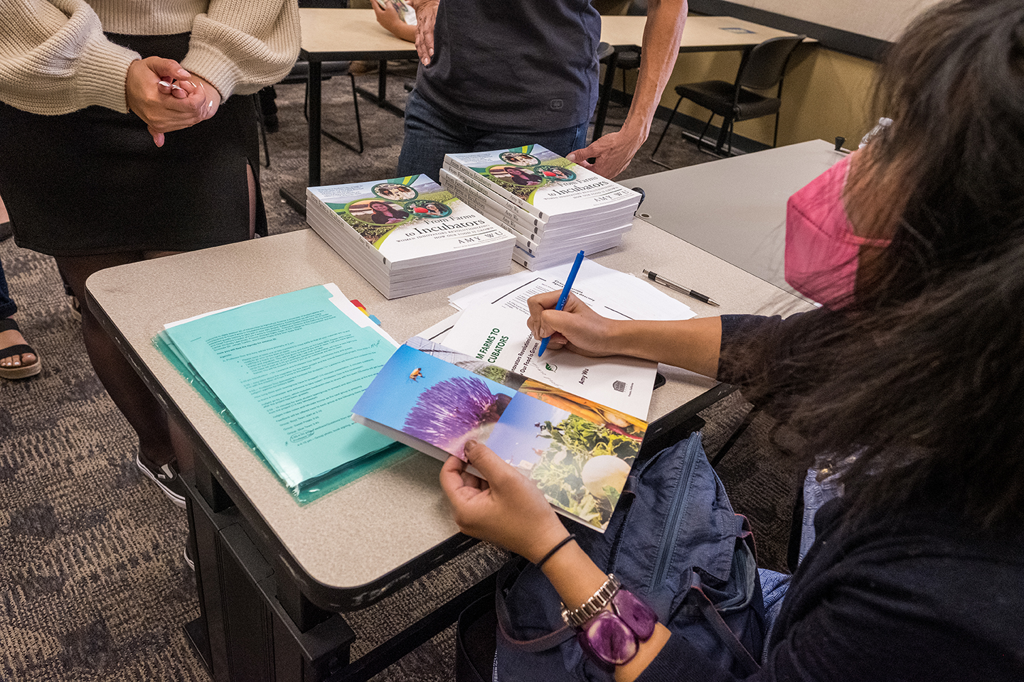 20220413-amy.wu-210.jpg Amy Wu signs a copy of her book at Stanislaus State.
