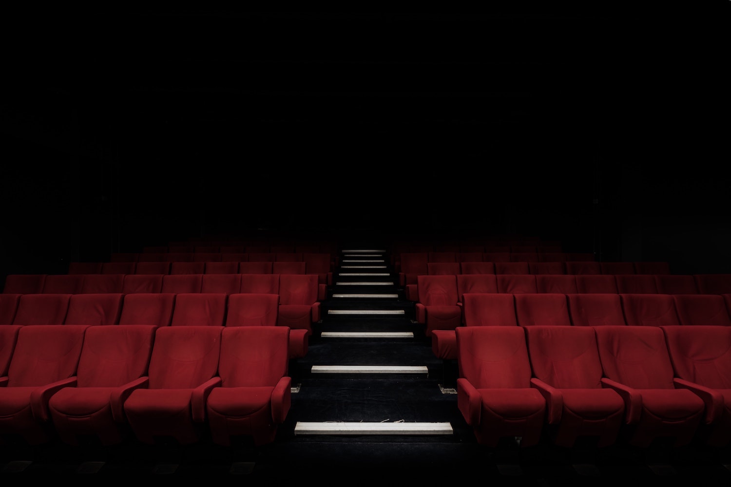 Movie theatre seats in the dark