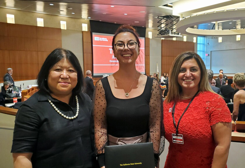 President Junn with Lisamarie Raimondo and Alumni Council chair