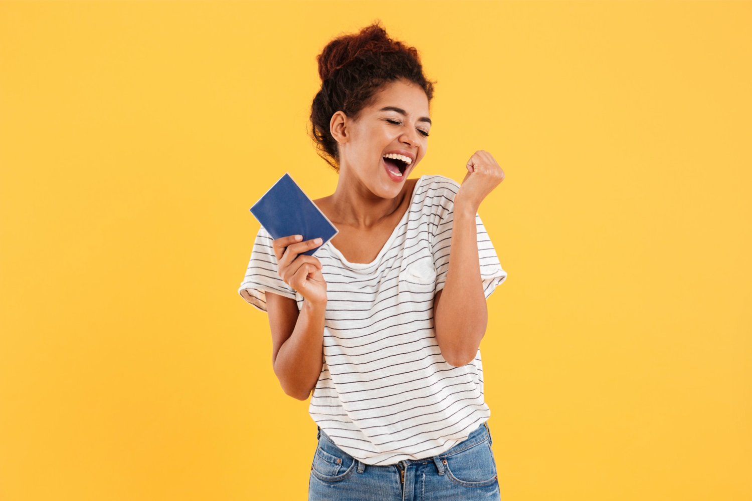 female student holding passport booklet