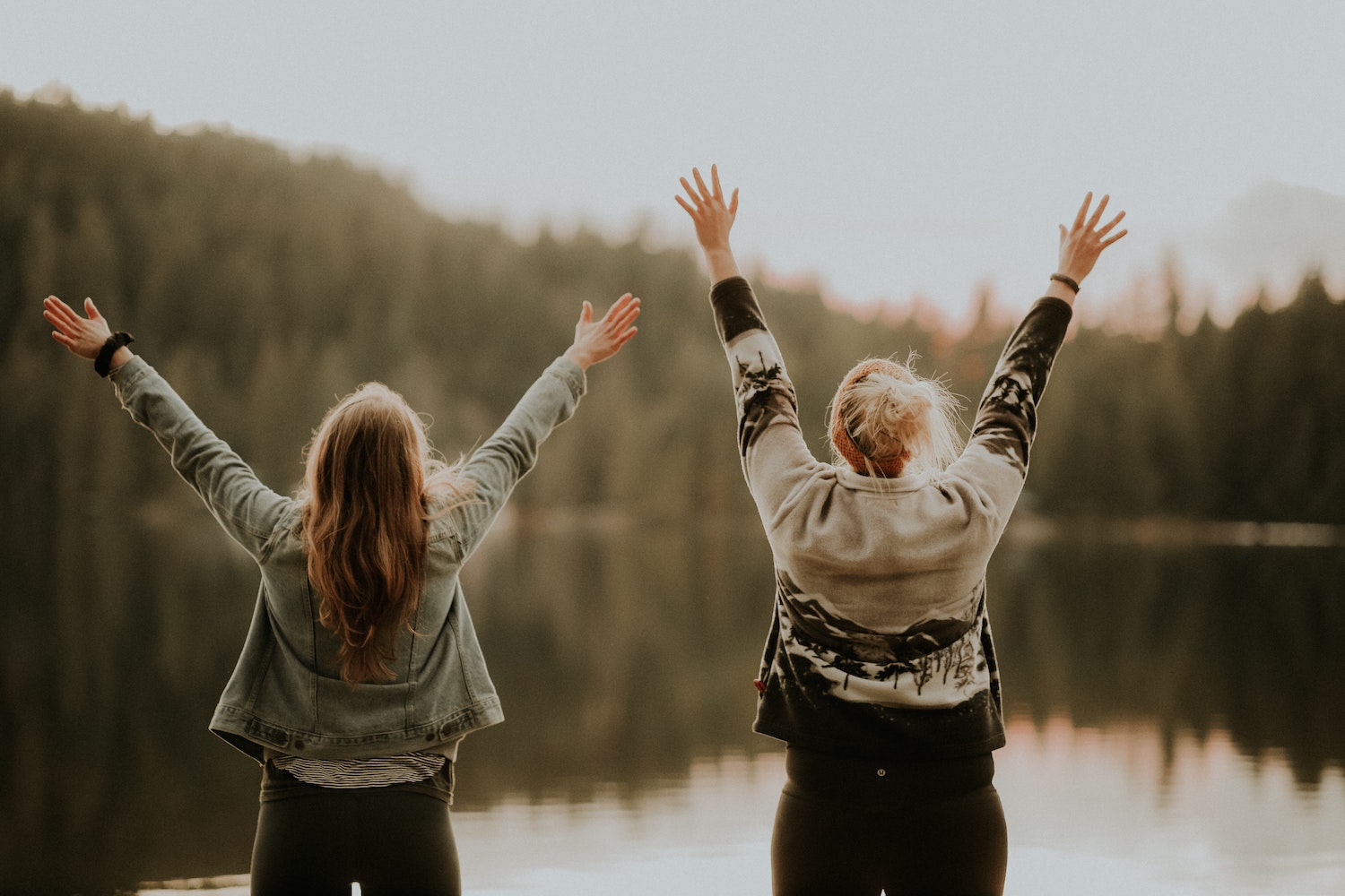 two women with hands up