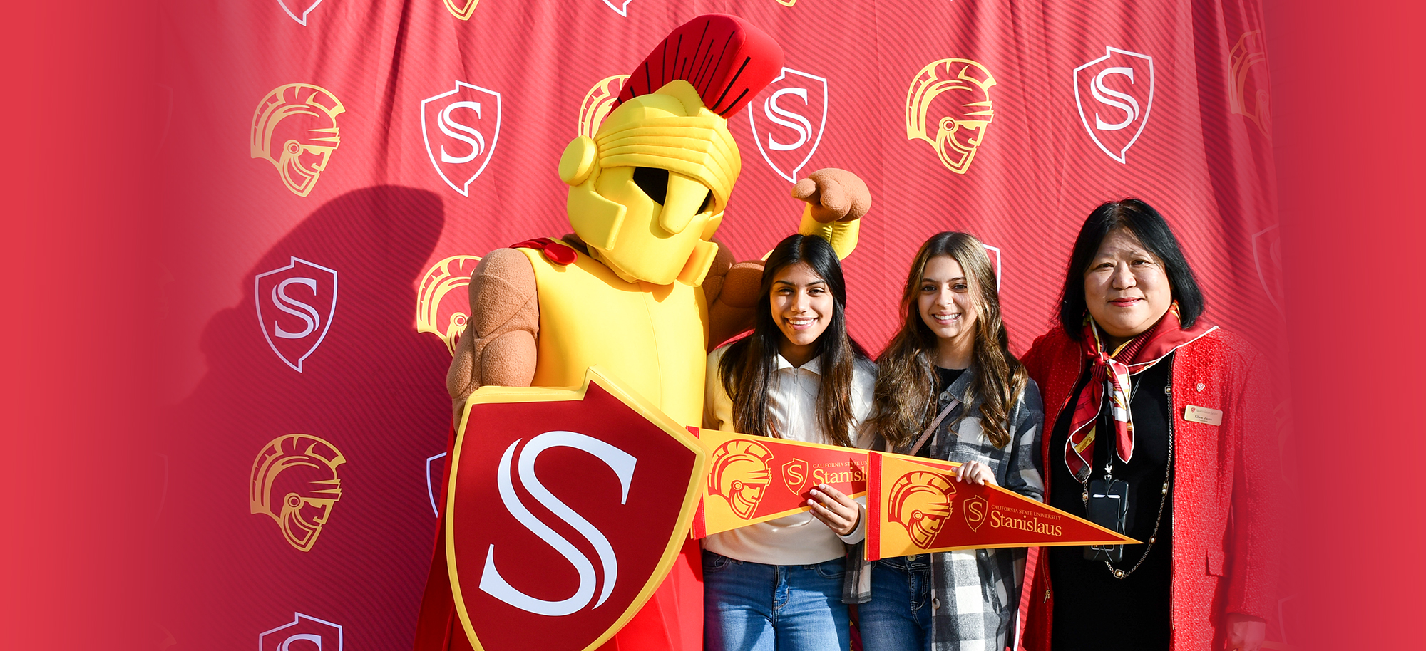 President Junn and Titus with students at Warrior Expo