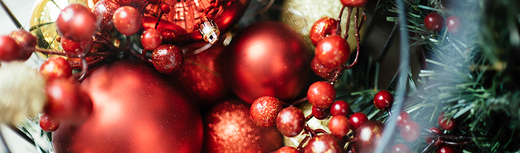 Christmas tree ornaments, berries , and leaves