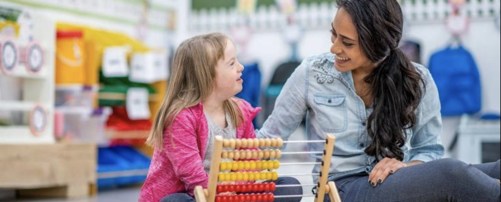 education_specialist.png Teacher talking to a child