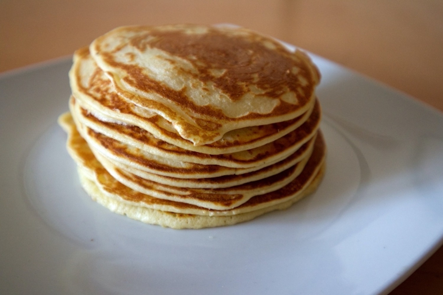 Stack of pancakes on a white plate