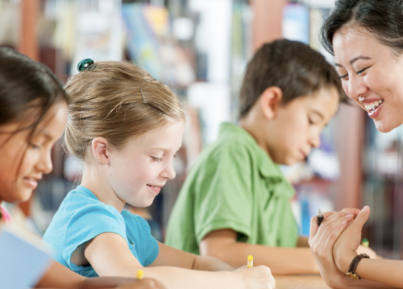 camp-preschool-we-are-hiring.png Teacher talking to students