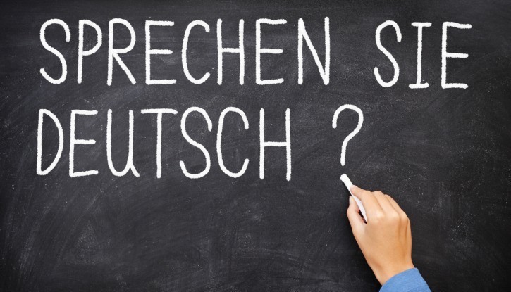 Blackboard with phrase "Sprechen sie Deutch?" in German or "Do you speak German?" in English
