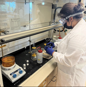 stem_cru.jpeg Person conducting an experiment in a lab