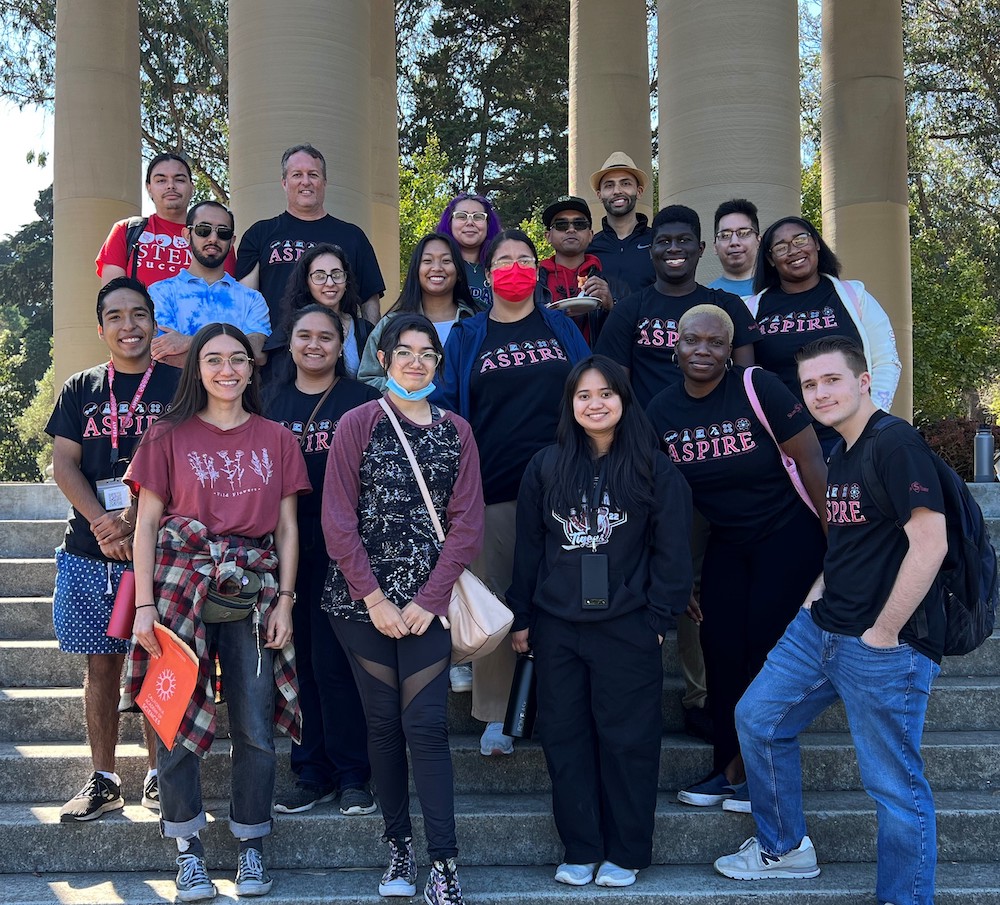 stem_cru_3.jpeg Group of people standing in a cluster on steps outside