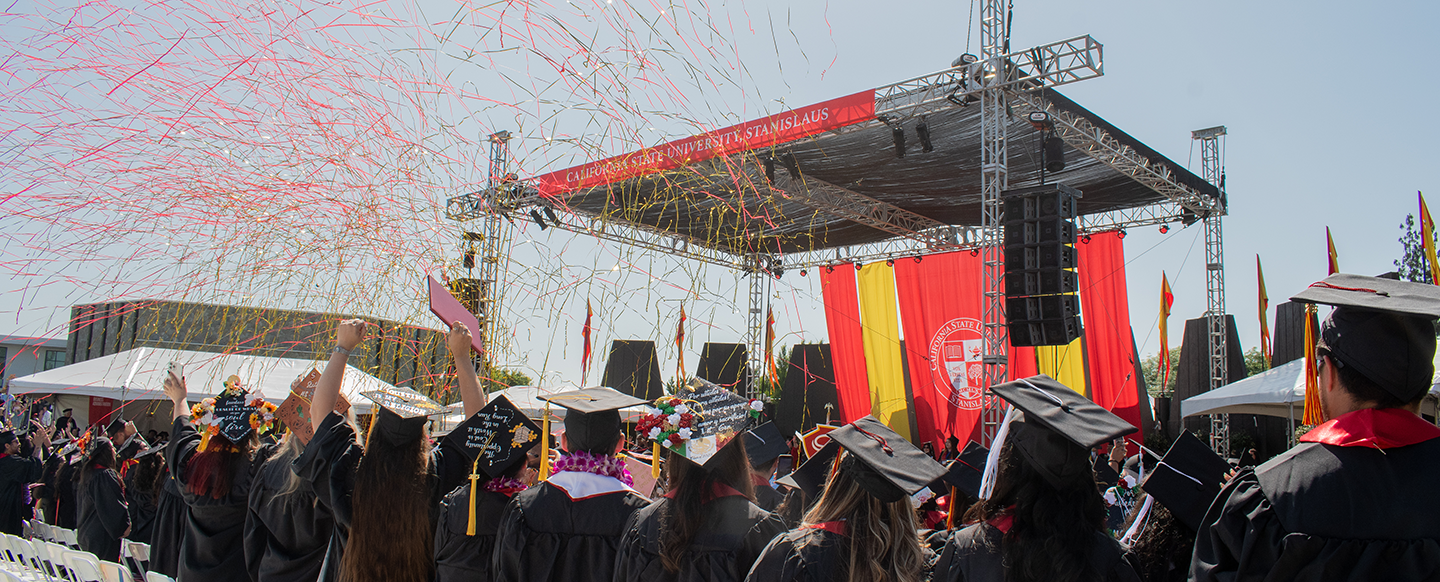 Confetti rains down on graduates during Commencement.