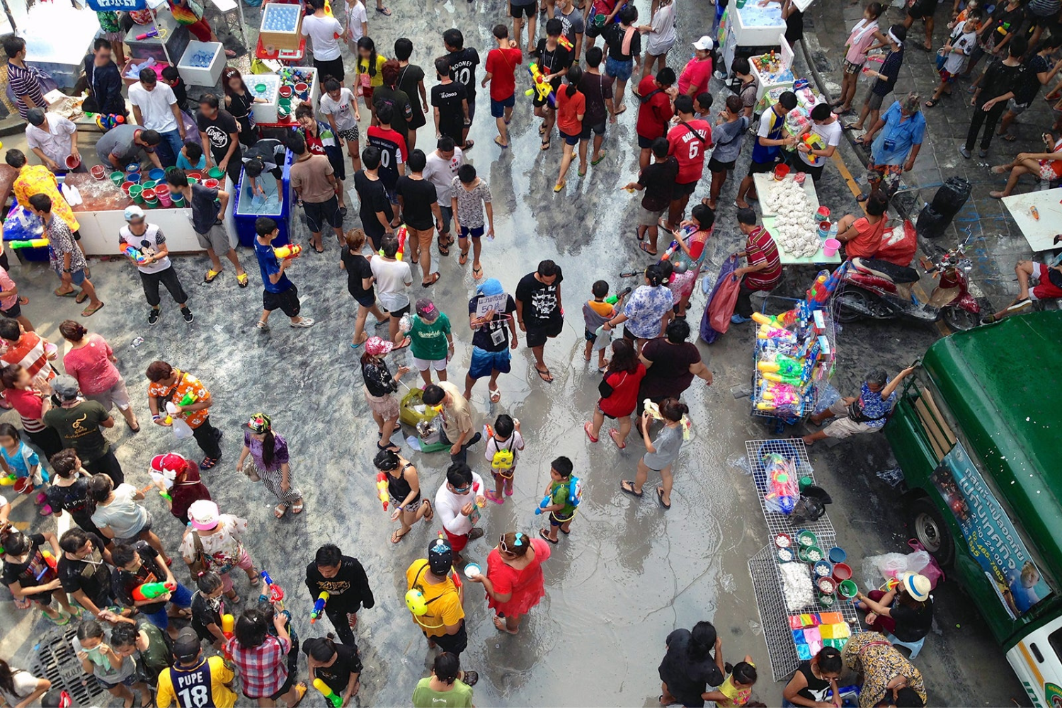 Aerial view of a crowded market selling Asian market goods.