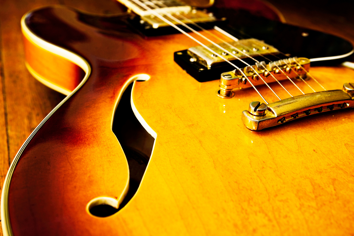 Close up image of a jazz guitar.