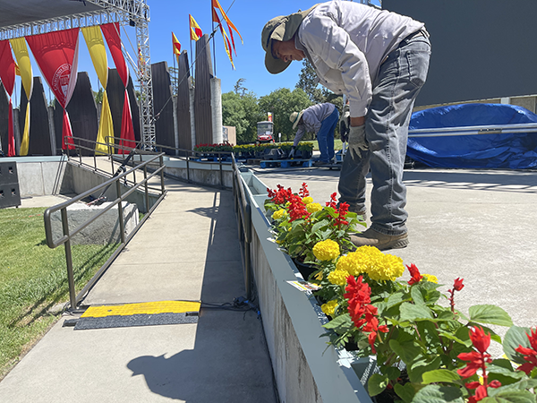 Facilities Services staff members prepare for Commencement.