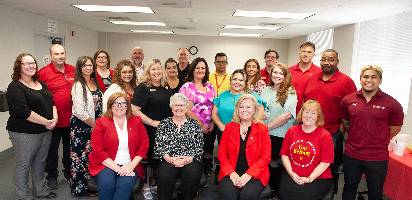 Group shot of leadership and staff at the Stockton Campus