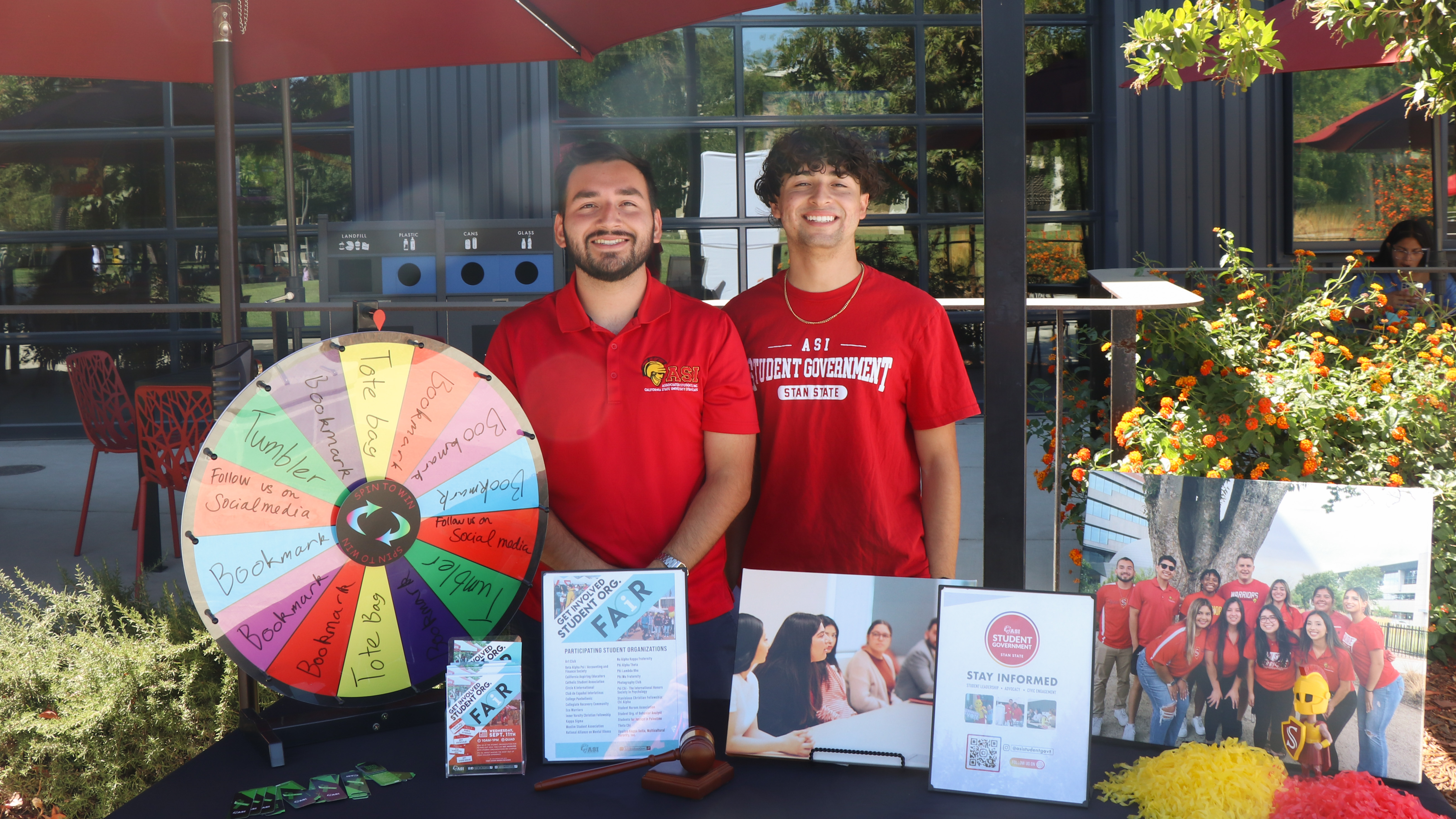 two students promoting student government with a whee