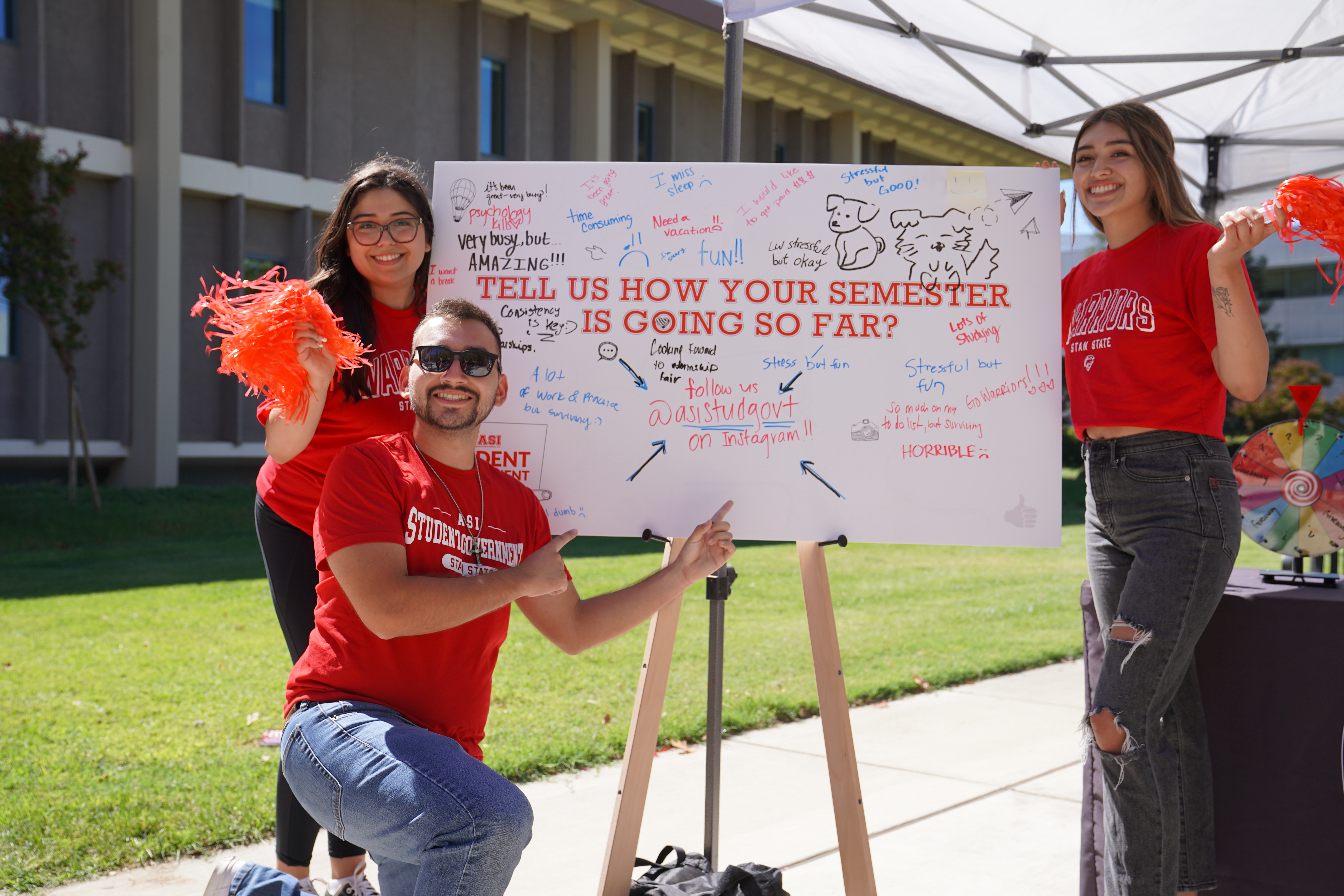 Students surrounding white board promoting student governemnt