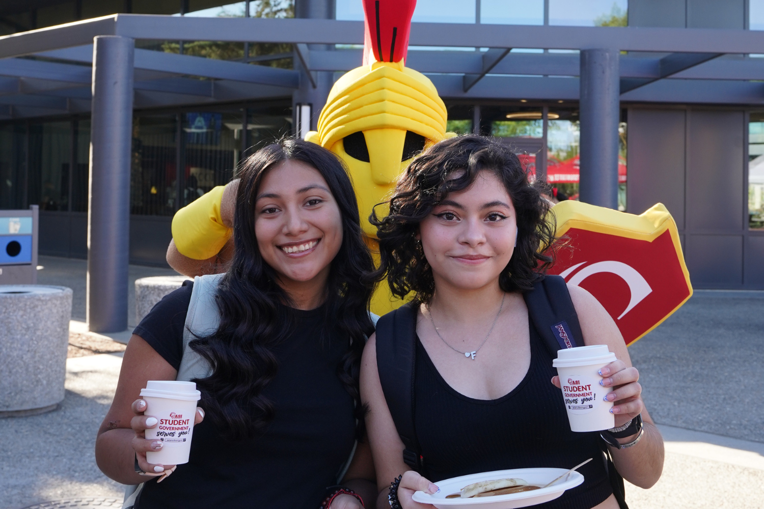 Titus and Students holding coffee and pancakes