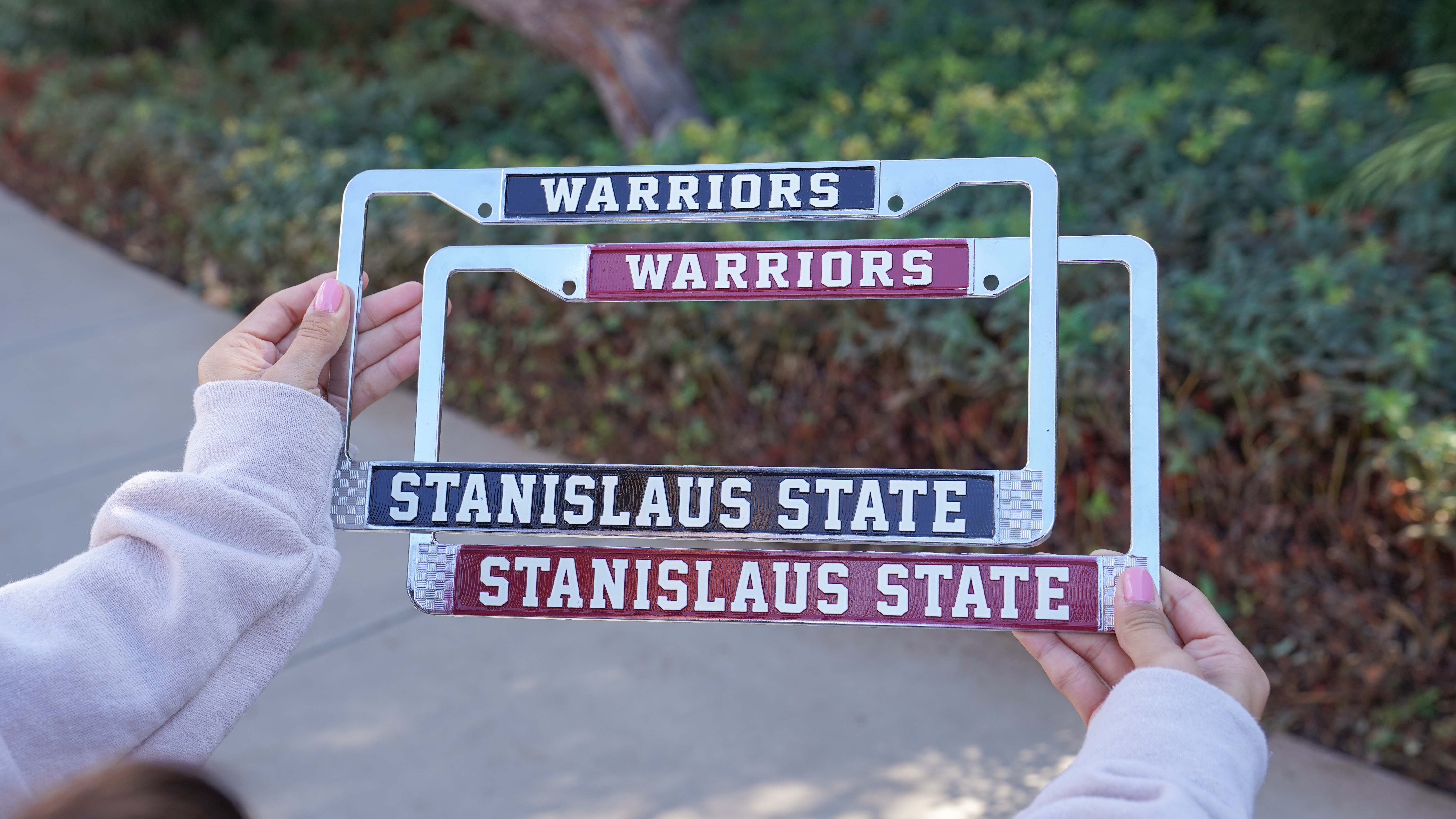 two license plat frames overlapping each other