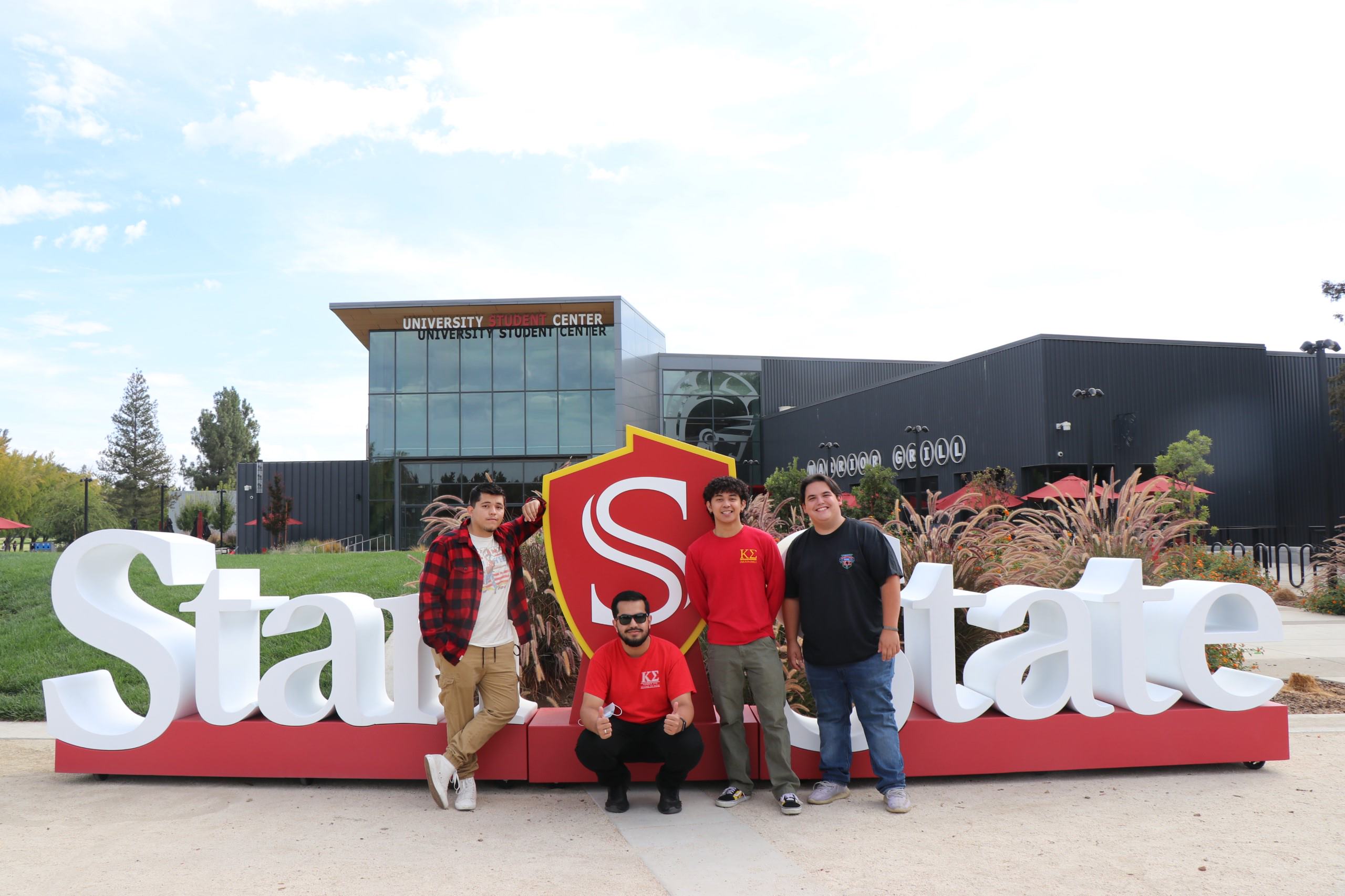 Two students in front of Big Stan State sign