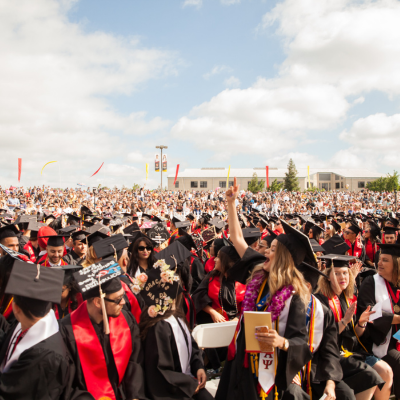 A crowd of graduate students from the Class of 2023 Commencement ceremonies at Stan State