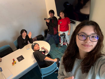 Riley Villalovoz and friends working together on a project for Documentary Videography class.