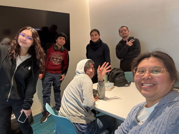 Alondra Aguilar and students working together on a project for Documentary Videography class.