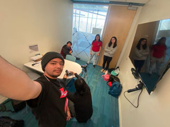 Gabriel Garcia and fellow class students working together on a project for Documentary Videography.