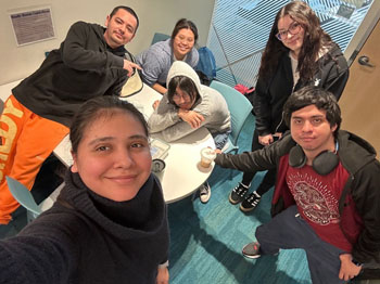 Alondra, Gabe, Moises, Ivana, Sergio and Riley work together on a video project.