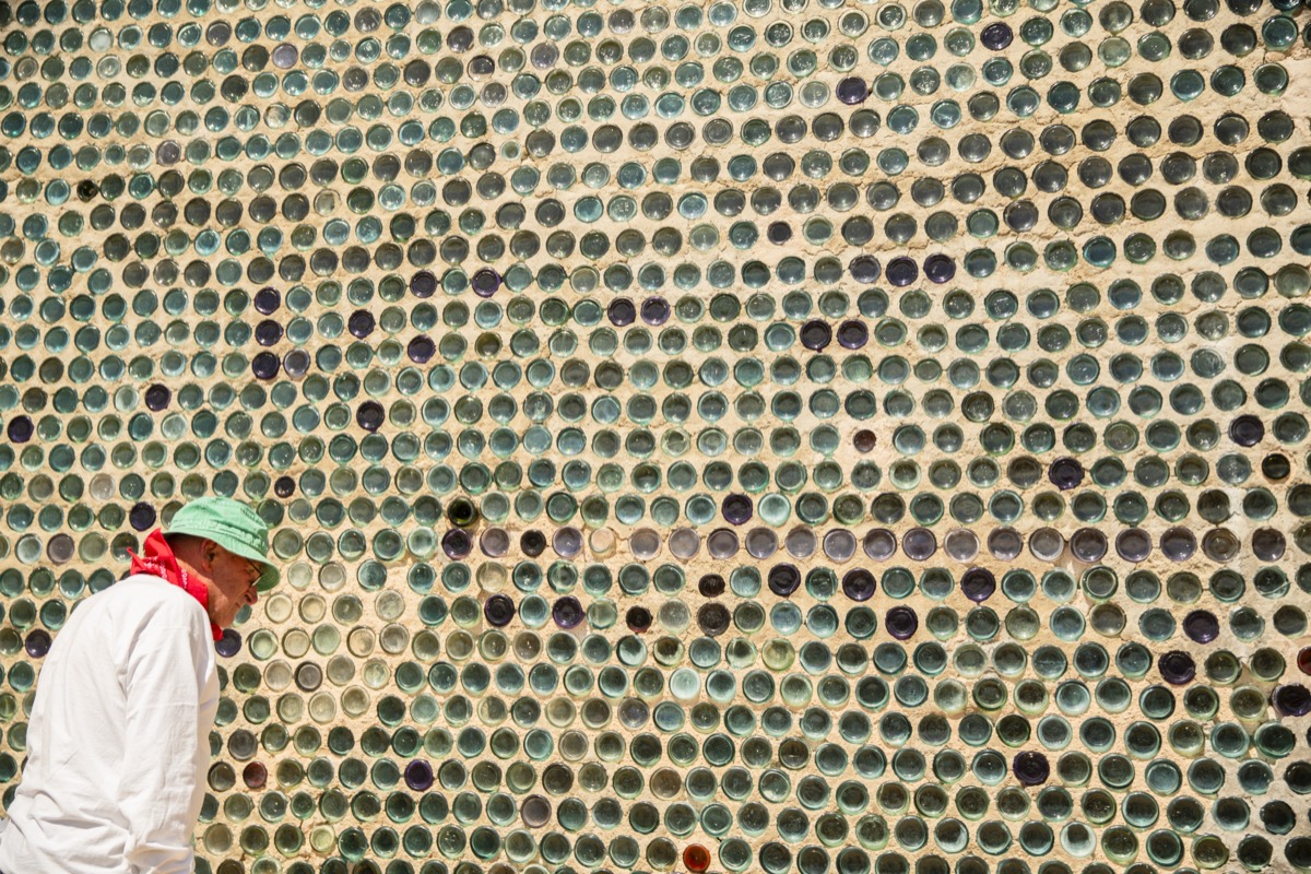 Chuck admiring the Tom Kelly Bottle House