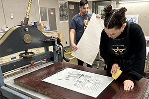 Students work together on a printmaking project.
