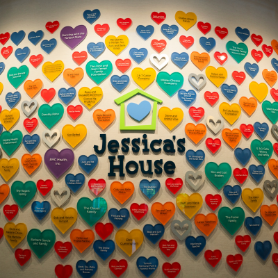 A colorful mural adorned with hearts containing messages is seen at Jessica's House