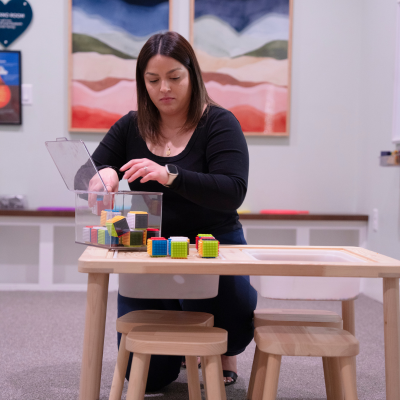 Staff member from Jessica's House is seen storing away children's toys