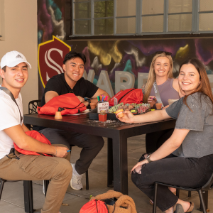 A group of students sat at a table at Stockton Campus