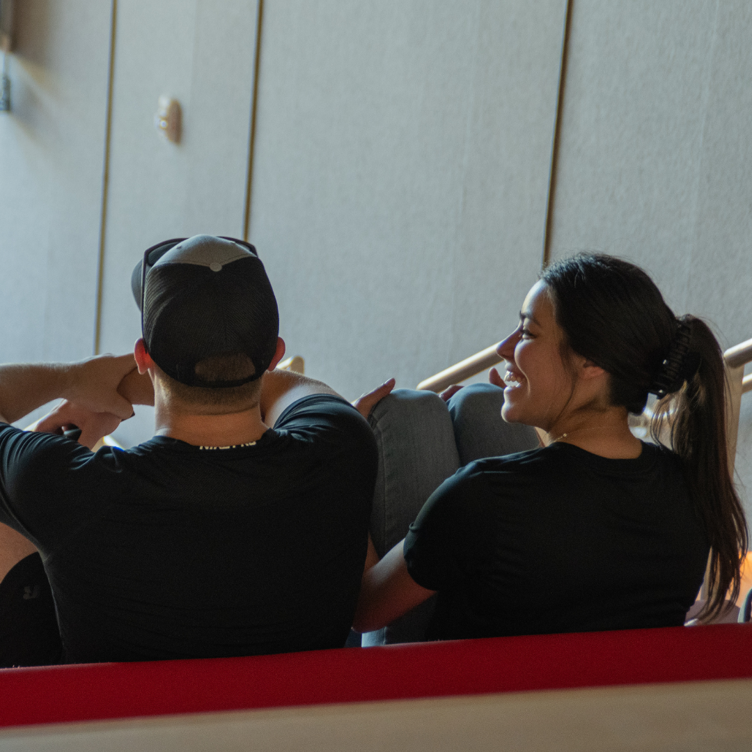 Photo of two students sitting together.