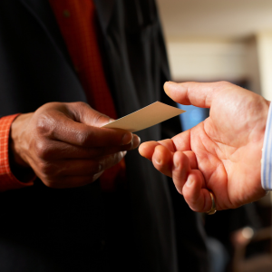 An employer handing over a business card