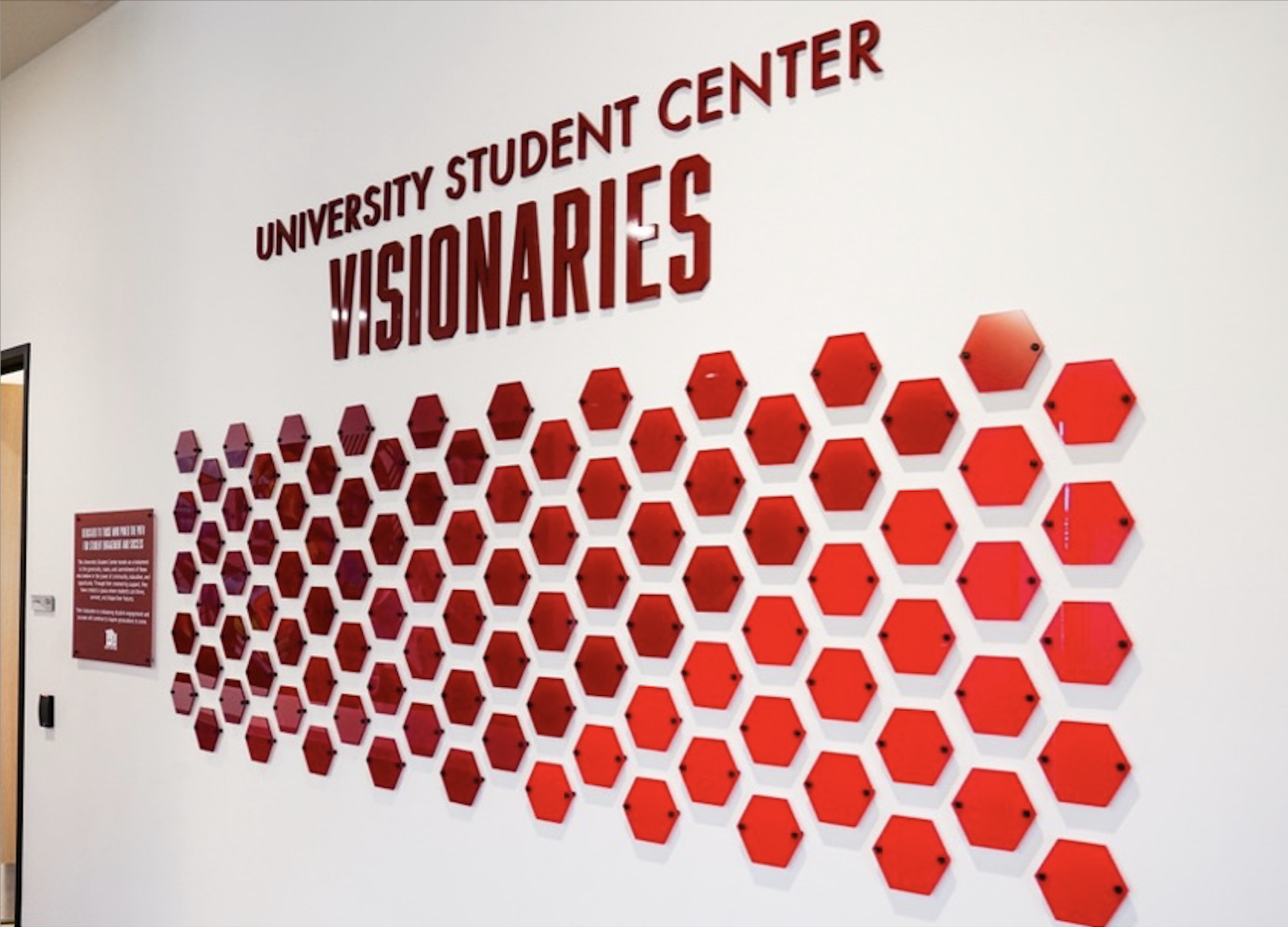 A wall is adorned by many of the visionary plaques from donors at the University Student Center.