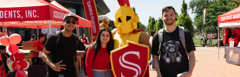 Students in a group photo with Titus at the quad