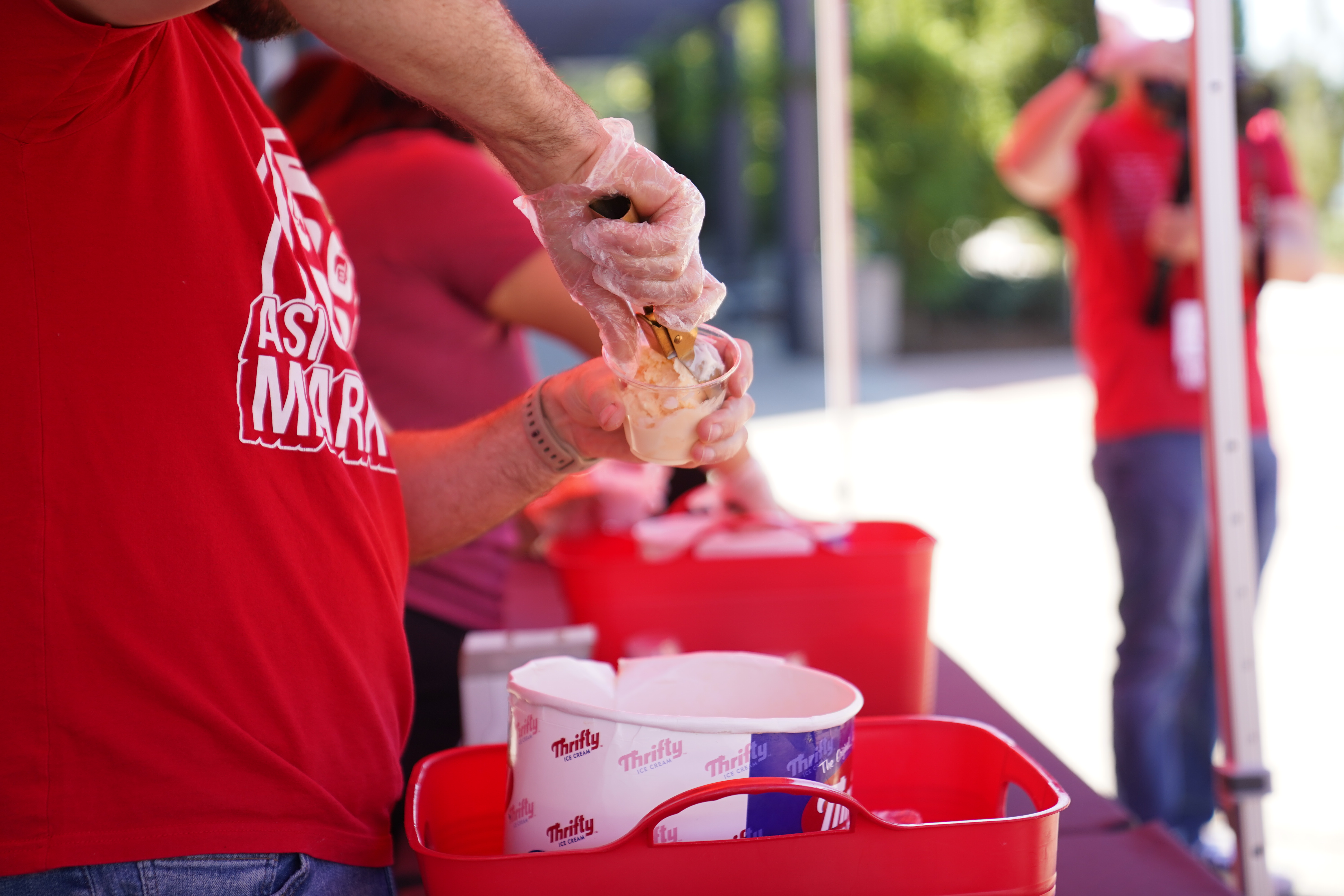 A person scooping ice cream