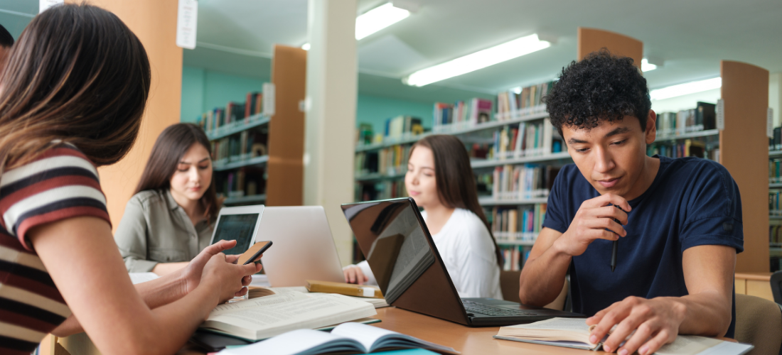 group of students studying in the library