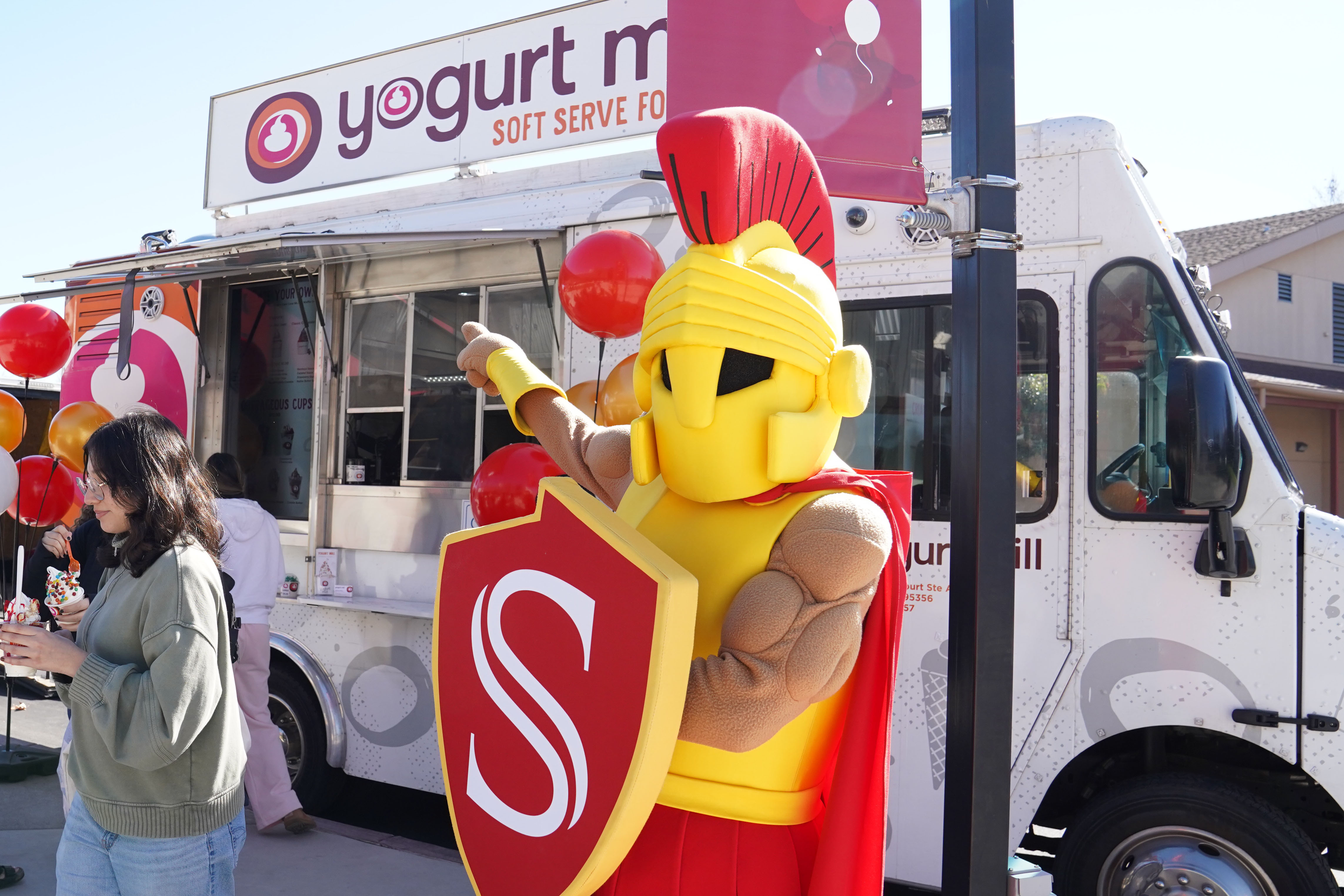 Titus pointing at Yogurt Mill Truck