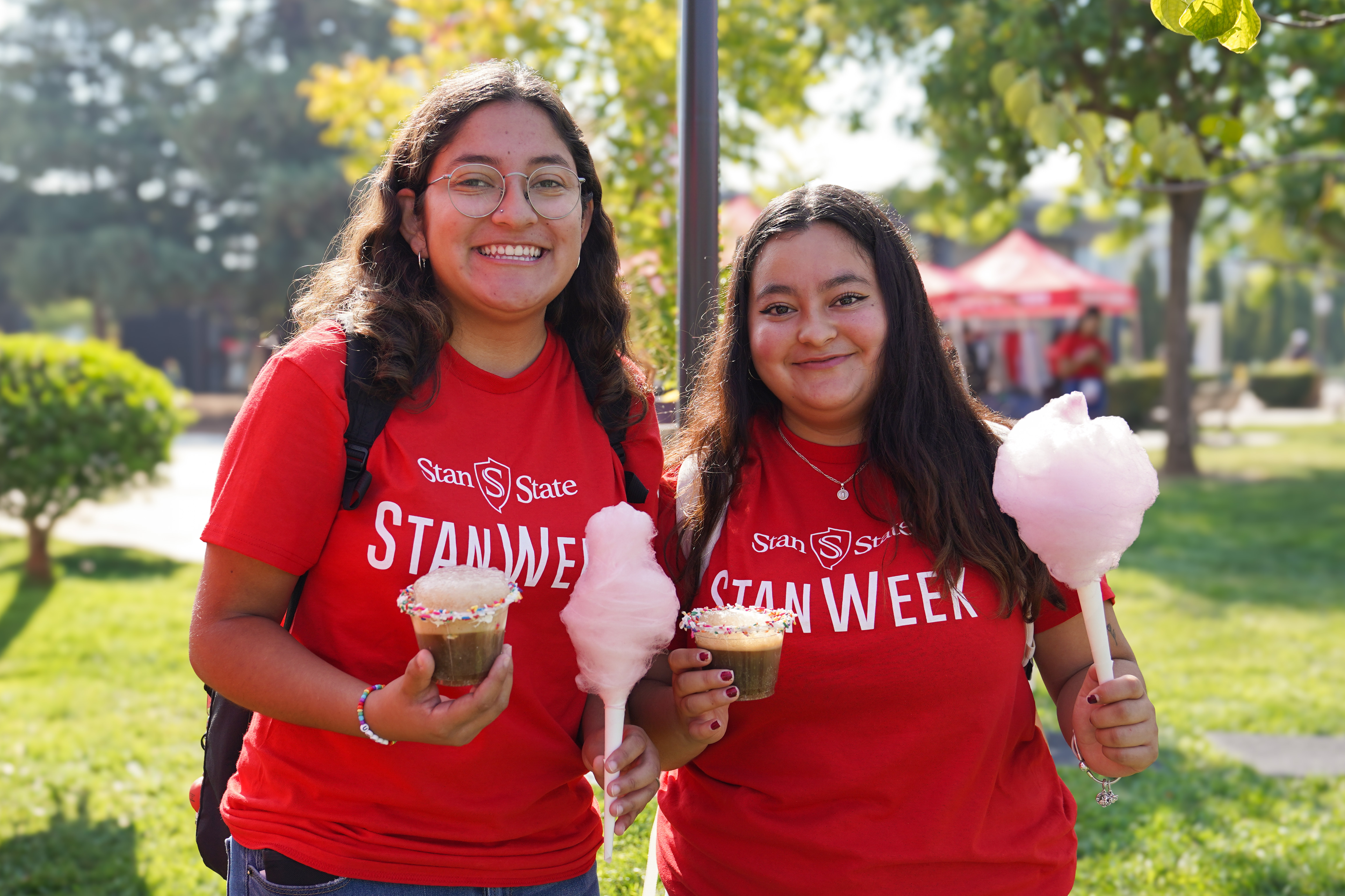 Two students holding cotton candy