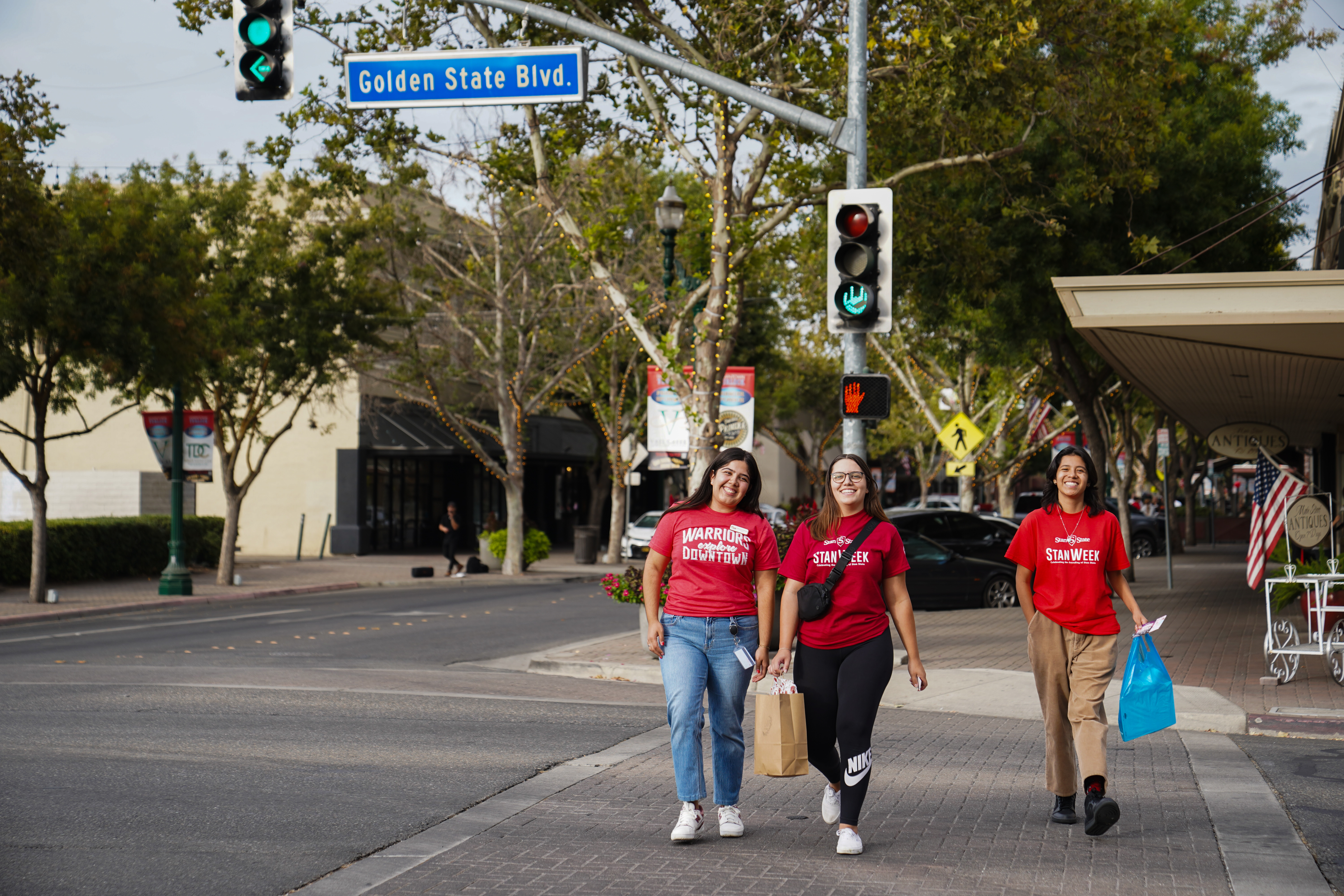 3 students walking in downtown Turlock