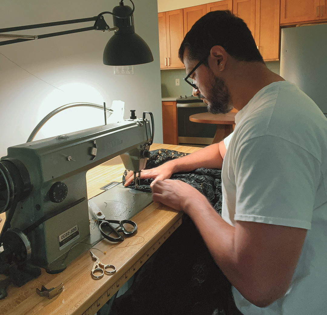 Tony Serrato works at a sewing machine.